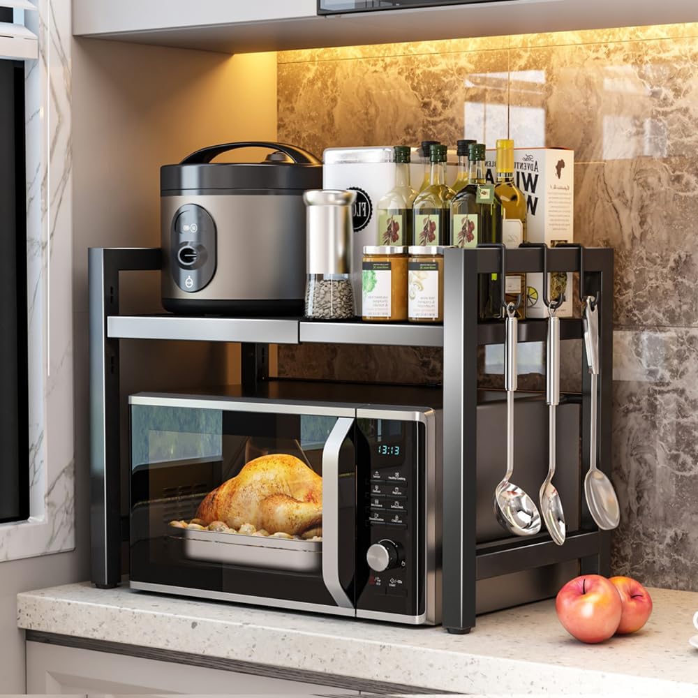BELIFEGLORY Expandable Microwave Rack with 6 Hooks, Countertop Microwave Shelf Stand Unit, Kitchen Storage & Organisation Spice Baker Rack Coffee Station Organiser (Black / 2-Tier)