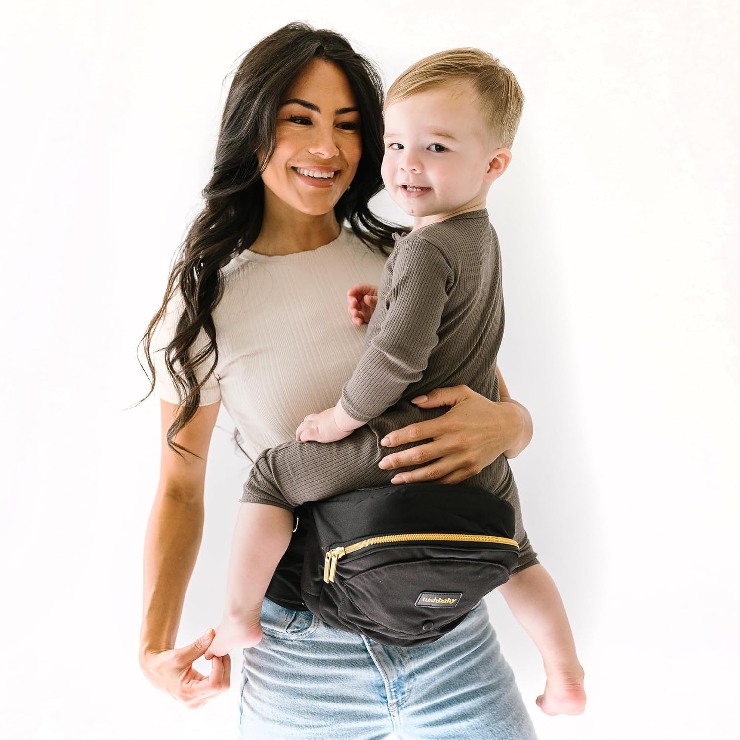 Tushbaby The Original Safety-Certified Hip Carrier for Babies & Toddlers: Machine Washable Child Waist Seat with Pocket Storage, As Seen on Shark Tank (23”-44” waist, 0-3 yrs up to 45lbs) – Black/Gold